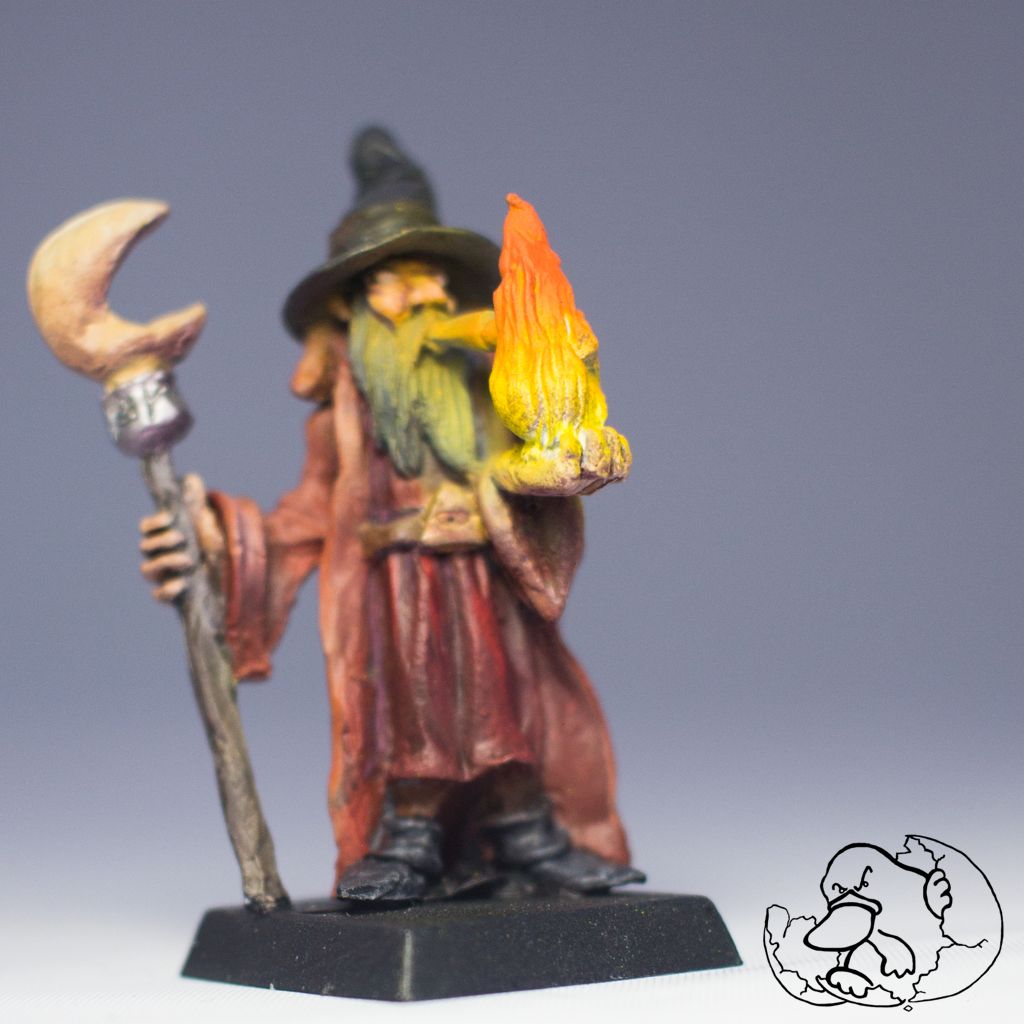 Pewter painted mini of epic fantasy of fire magician created by el huevo del ornitorrinco to use in wargame or any dungeon game