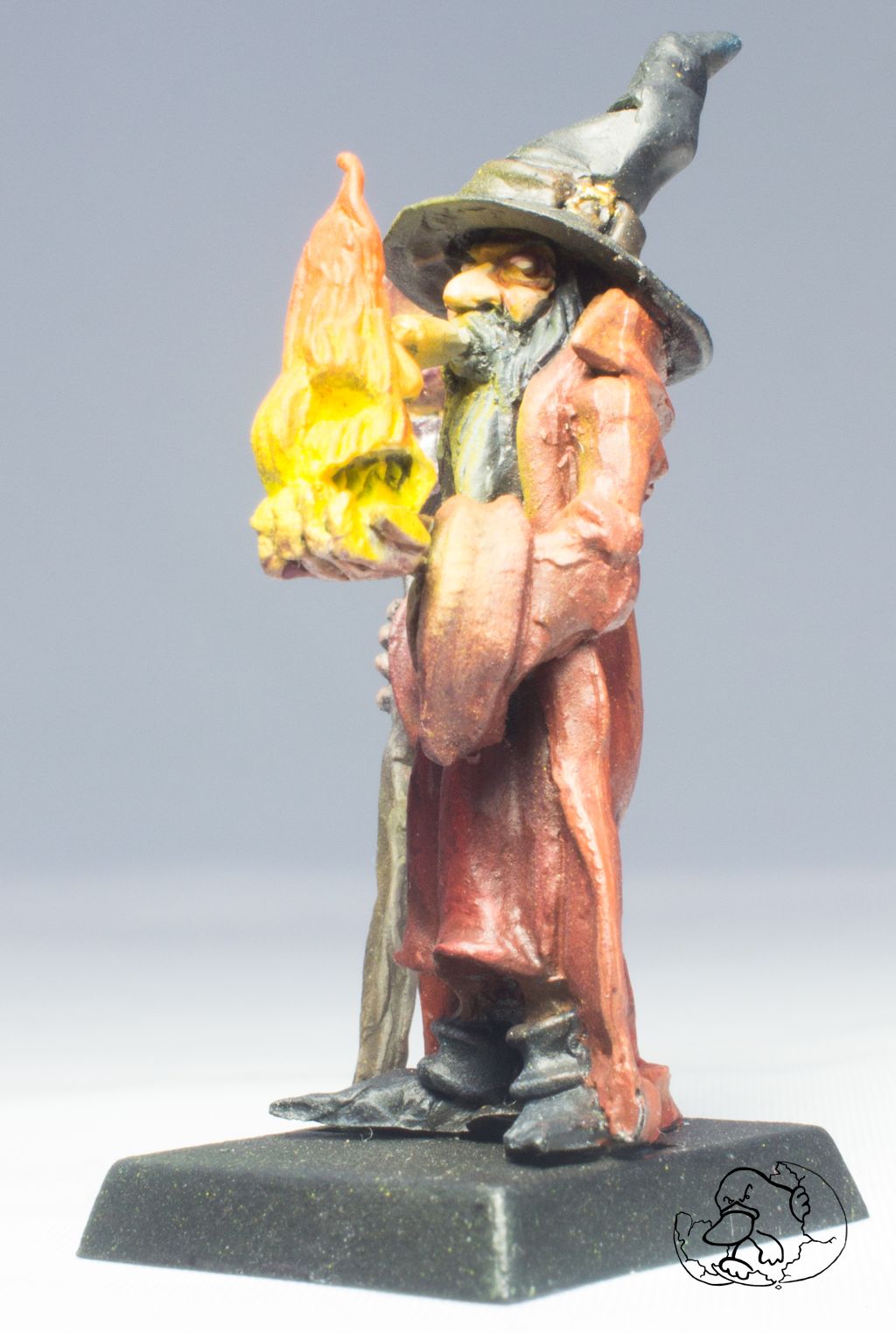 pewter miniature of a smoker wizard character with fire elemental to use by wargamers dungeoneers or role game players