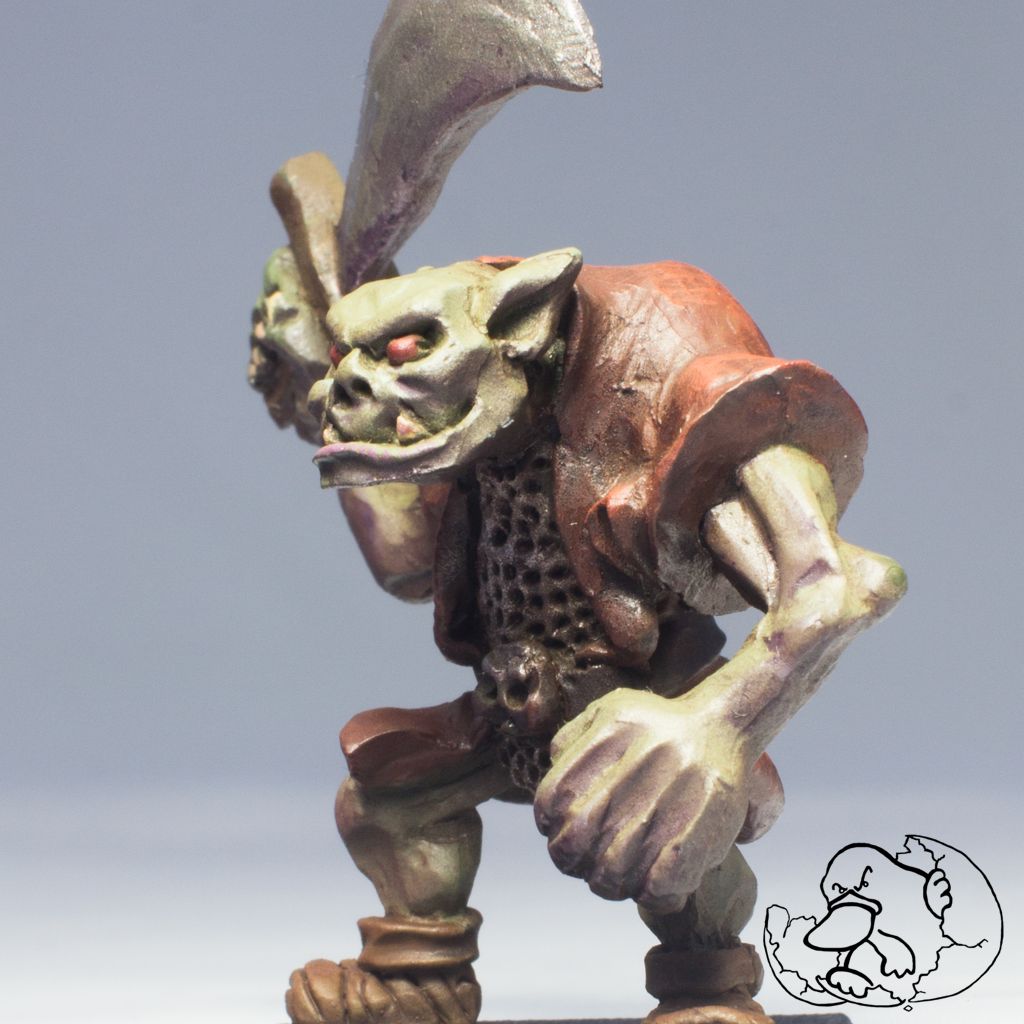 pewter miniature painted of a greenskin orc minion ideal for role game players and wargamers