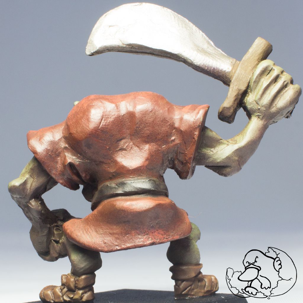 back of a metal miniature of a orc character