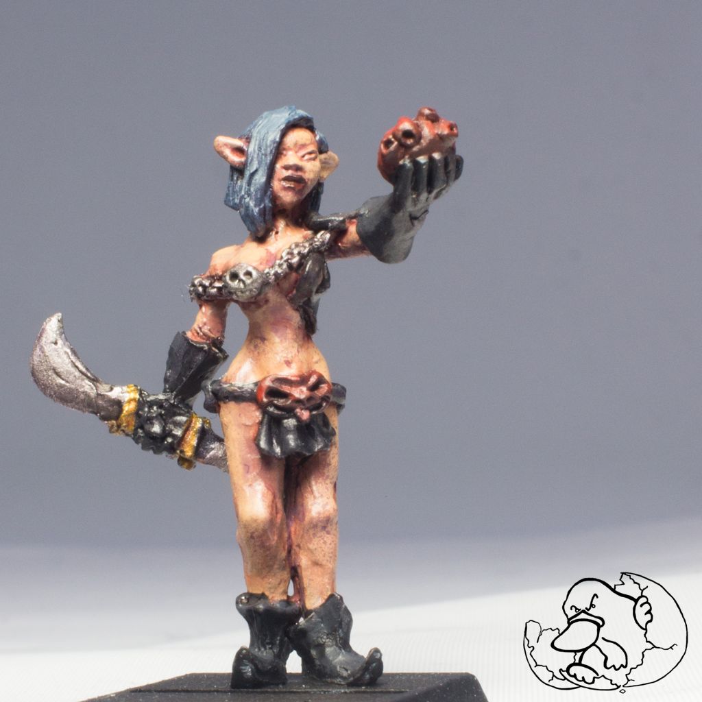 pewter character miniature painted of a woman evil and dark elf murderess for role game players and wargamers