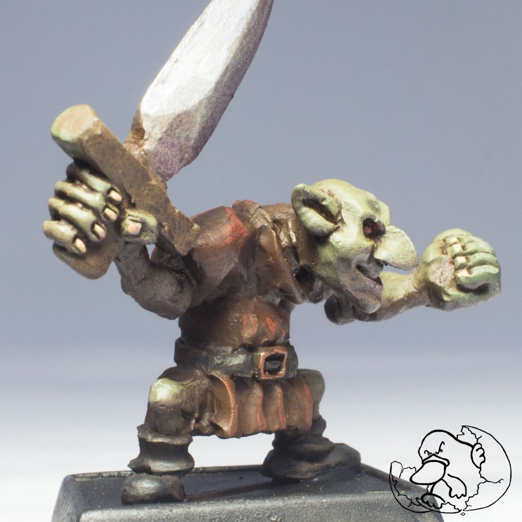 metal painted mini of a goblin character with sword to use for role game players and wargamers or dungeoneers